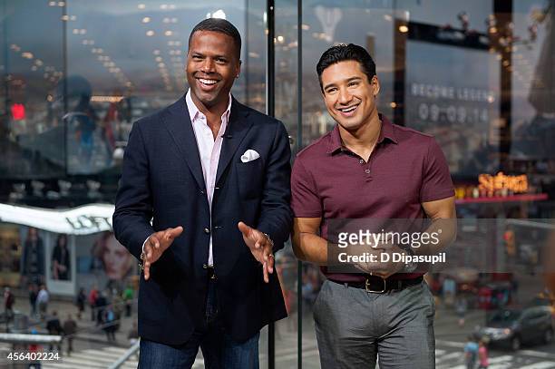 Mario Lopez and AJ Calloway host "Extra" at their New York studios at H&M in Times Square on September 30, 2014 in New York City.