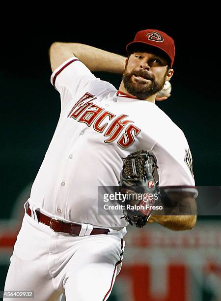 Starting pitcher Josh Collmenter of the Arizona Diamondbacks delivers a pitch against the San Francisco Giants during the first inning of a MLB game...