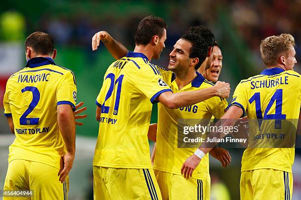 Nemanja Matic of Chelsea celebrates with team mate Cesc Fabregas as he scores their first goal during the UEFA Champions League Group G match between...