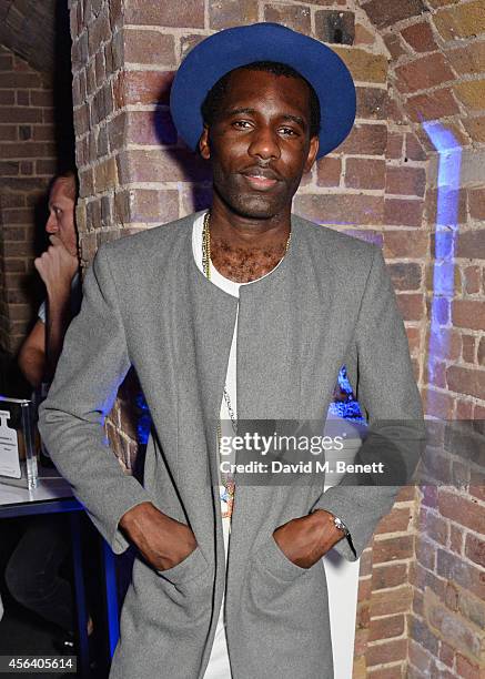 Wretch 32 attends the Disaronno Wears Versace limited edition bottle launch at One Mayfair on September 30, 2014 in London, England.