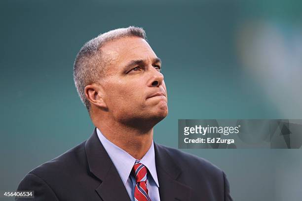 Kansas City Royals general manager Dayton Moore looks on prior to a game between the Detroit Tigers and Kansas City Royals at Kauffman Stadium on...