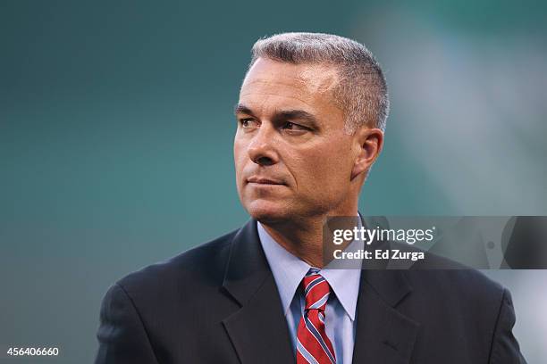 Kansas City Royals general manager Dayton Moore looks on prior to a game between the Detroit Tigers and Kansas City Royals at Kauffman Stadium on...