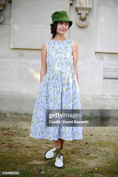 Jupe by Jackie's Wara Juana Gutierrez Mamani poses wearing a Jupe by Jackie dress and Dr. Martens shoes on September 30, 2014 in Paris, France.