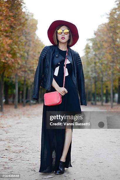 Stylist Faye Tsui poses wearing a Black Orchid jacket, Blessed are the Meek dress, Valentino shoes and bag and Sunday Somewhere sunglasses on...