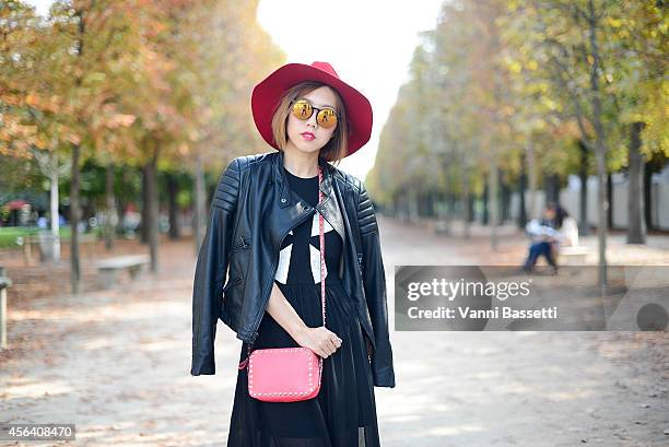 Stylist Faye Tsui poses wearing a Black Orchid jacket, Blessed are the Meek dress, Valentino bag and Sunday Somewhere sunglasses on September 30,...