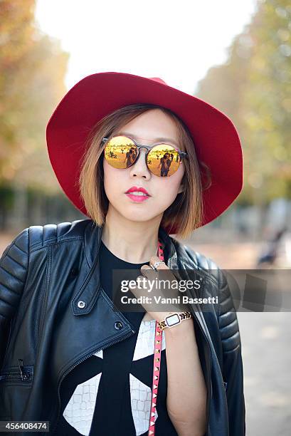 Stylist Faye Tsui poses wearing a Black Orchid jacket, Blessed are the Meek dress, Sunday Somewhere sunglasses and Chanel watch on September 30, 2014...