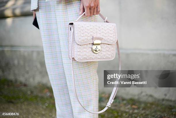 Linda Tol poses wearing N duo concept suit and Azzurra Gronchi bag on September 30, 2014 in Paris, France.