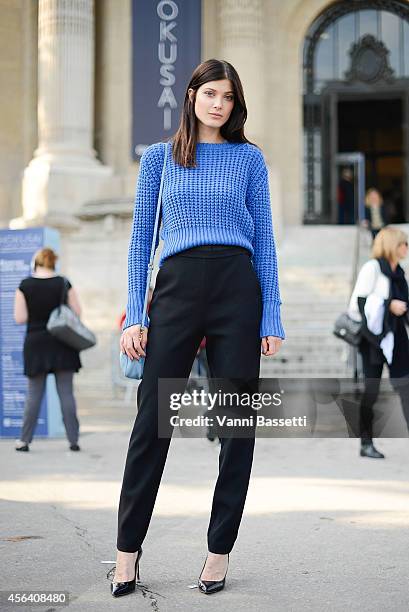 Model Larissa Hofmann poses wearing an Acne jumper, Proenza Schouler pants, Valentino shoes and Miu Miu bag on September 30, 2014 in Paris, France.