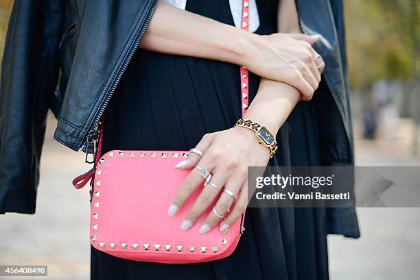 Stylist Faye Tsui poses wearing a Black Orchid jacket, Blessed are the Meek dress, Valentino bag and Chanel watch on September 30, 2014 in Paris,...
