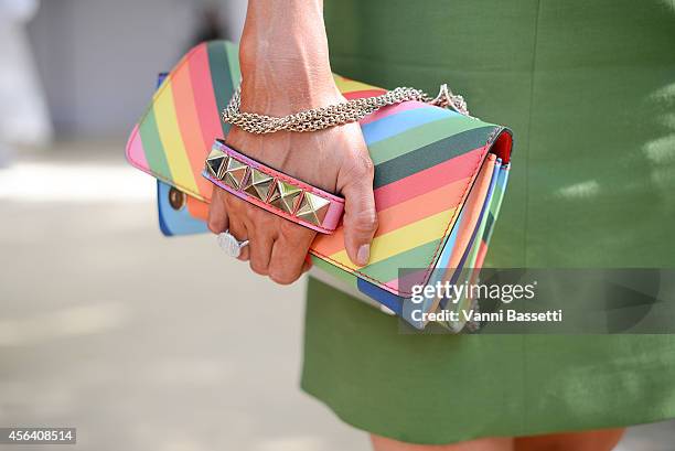 Paris Hilton poses wearing Valentino after the Valentino show on September 30, 2014 in Paris, France.