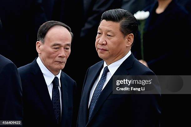 Chinese President Xi Jinping and Secretary of the Central Commission for Discipline Inspection Wang Qishan arrive the Monument to the People's Heroes...