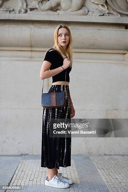 Clothilde Pasquier poses wearing an American Apparel top, vintage skirt and bag and Adidas shoes on September 30, 2014 in Paris, France.