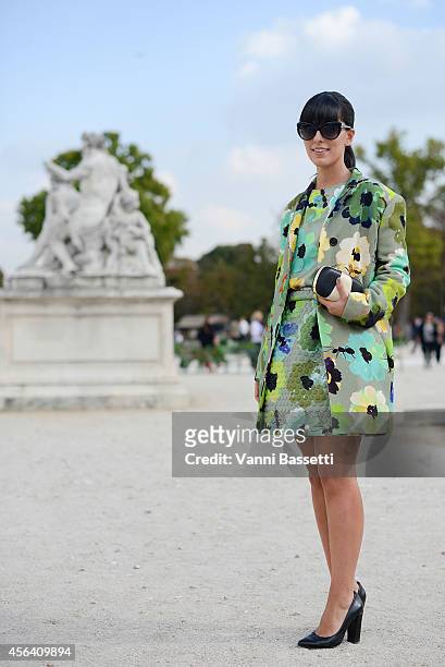 Fashion blogger Laura Comolli poses wearing a Giulia Rositani dress and Thale Blanc clutch on September 30, 2014 in Paris, France.