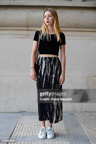 Clothilde Pasquier poses wearing an American Apparel top, vintage skirt and Adidas shoes on September 30, 2014 in Paris, France.