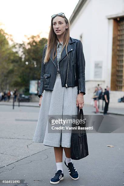 Veronica Ehni poses wearing a Sandro jacket, Wood Wood top, skirt and bag and Adidas shoes on September 30, 2014 in Paris, France.