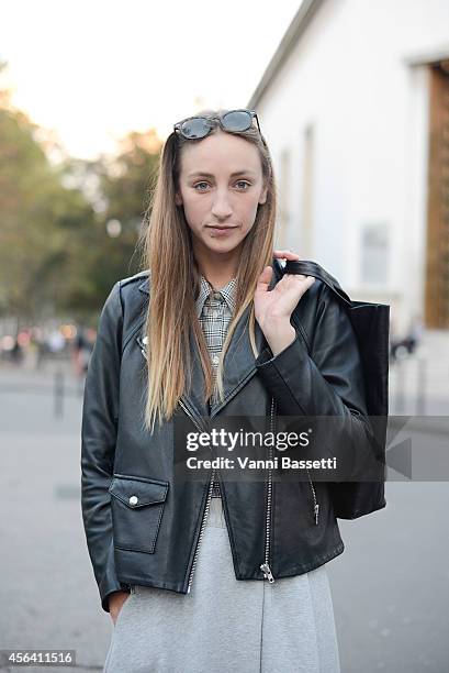 Veronica Ehni poses wearing a Sandro jacket, Wood Wood top, skirt and bag on September 30, 2014 in Paris, France.