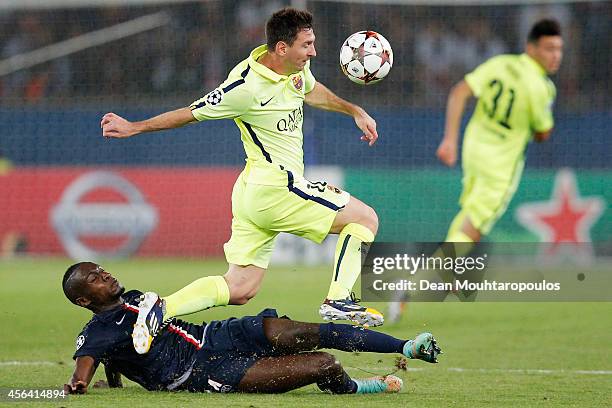 Lionel Messi of Barcelona skips the takle from Blaise Matuidi of PSG during the Group F UEFA Champions League match between Paris Saint-Germain v FC...