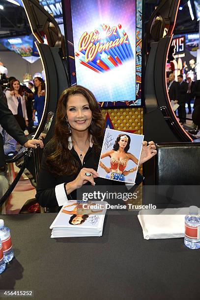 Lynda Carter poses for a photo at th Bally booth by the new Wonder Woman slot machine at the 14th Annual Global Gaming Expo at the Sand Expo and...