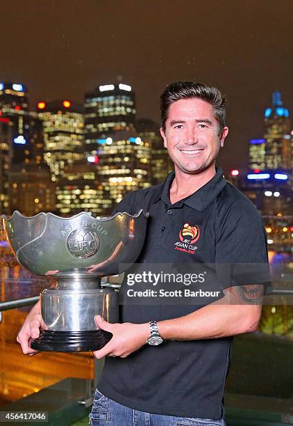 Melbourne Asian Cup Ambassador Harry Kewell poses with the Asian Cup at the Asian Cup Ambassador announcement on September 24, 2014 in Melbourne,...