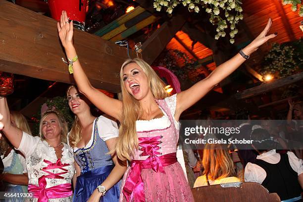 Rosanna Davison wearing a Dirndl of 'Alpenmaedel' during the 'Haarwerk Blond Wiesn' at Oktoberfest at Kaeferzelt/Theresienwiese on September 30, 2014...