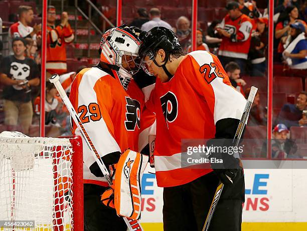 Ray Emery of the Philadelphia Flyers is celebrates the win with teammate Luke Schenn after the game against the New York Rangers on September 30,...