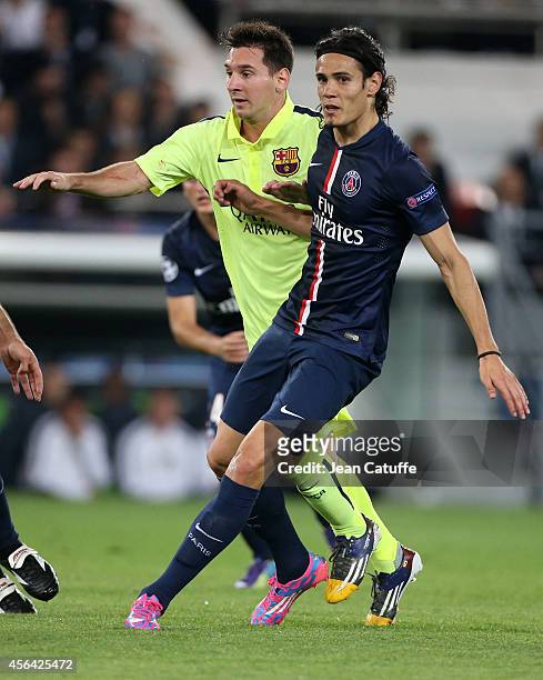 Lionel Messi of Barcelona and Edinson Cavani of PSG in action during the UEFA Champions League Group F match between Paris Saint-Germain FC and FC...