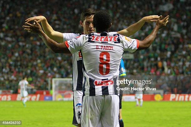 Dorlan Pabon of Monterrey celebrates with Bernardo Hernandez of Monterrey after scoring the third goal of his team during a match between Leon and...