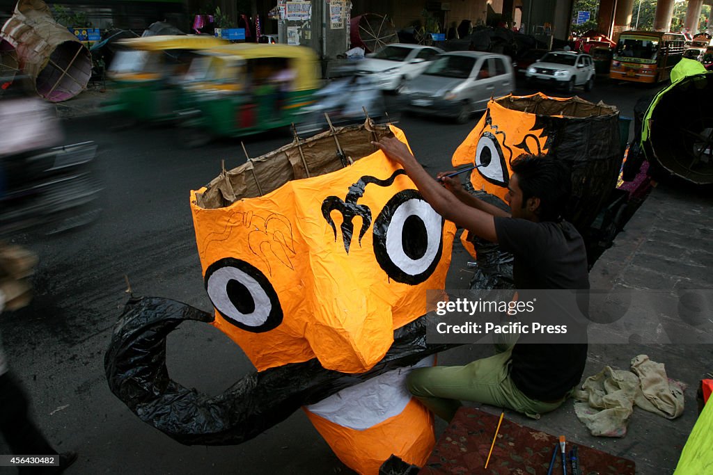 An artist prepares the  effigy of Demon King  Ravana for...