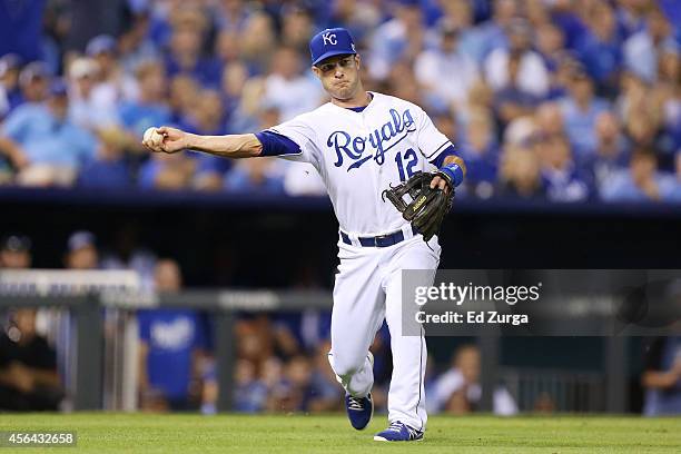Jayson Nix of the Kansas City Royals fields a ball during the American League Wild Card game against the Oakland Athletics at Kauffman Stadium on...