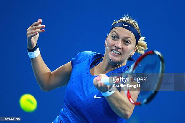 Petra Kvitova of Czech Republic returns against Shuai Peng of China during day five of the China Open at the China National Tennis Center on October...