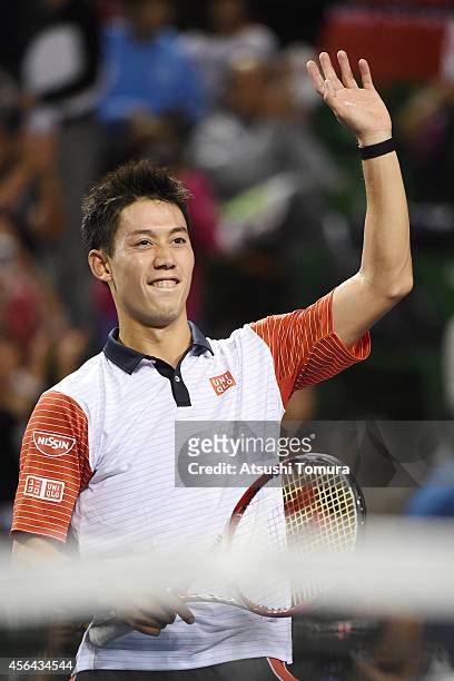 Kei Nishikori of Japan waves to fans after winning the men's singles second round match against Ivan Dodig of Croatia on day three of Rakuten Open...