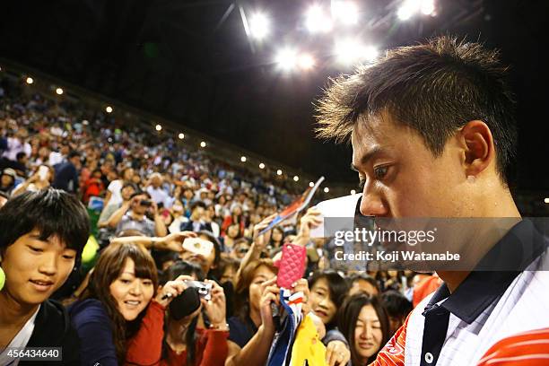 Kei Nishikori of Japan interact with fans after winning the men's singles second round match against Ivan Dodig of Croatia on day three of Rakuten...