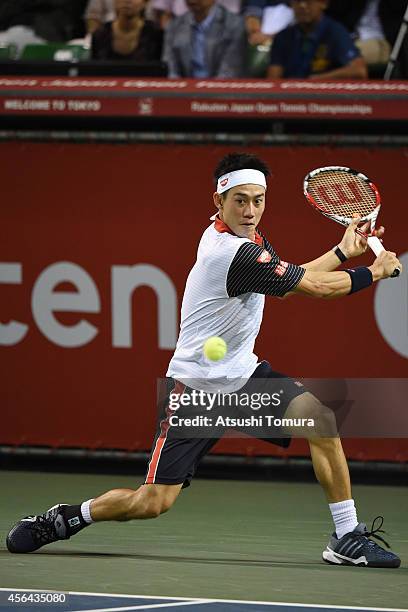 Kei Nishikori of Japan in action during the men's singles second round match against Ivan Dodig of Croatia on day three of Rakuten Open 2014 at...