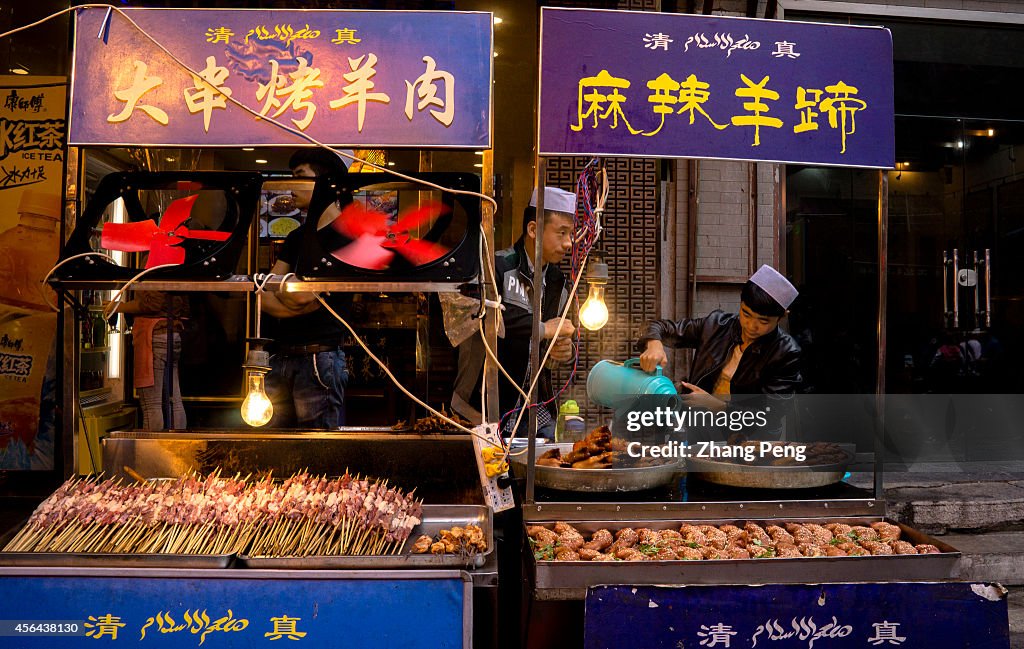 Snack stalls of spicy kebabs and baked sheep feet.  The...