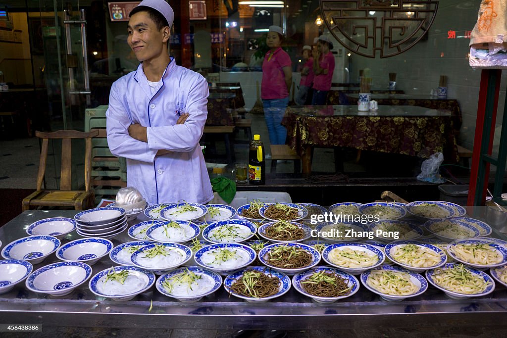 A noodle stall on Huiminjie food street iin the Muslim...