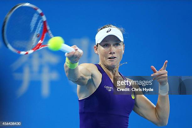 Samantha Stosur of Australia plays a forehand in her match against Caroline Wozniacki of Denmark during day five of of the China Open at the National...