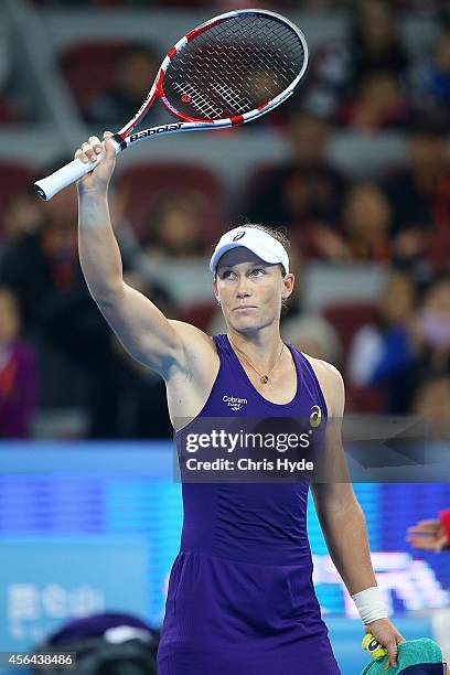 Samantha Stosur of Australia celebrates winning her match against Caroline Wozniacki of Denmark during day five of of the China Open at the National...