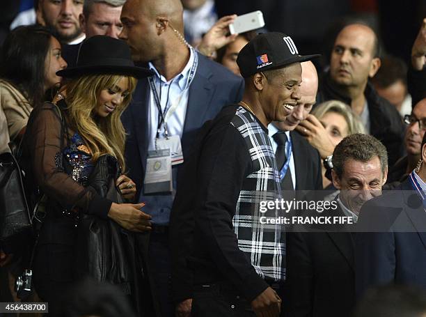 Rapper and record producer Jay-Z and his wife, US singer Beyonce arrive to attend the UEFA Champions League football match between Paris...