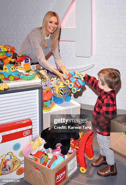 Tess Daly attends a photocall to launch the Argos Toy Exchange Argos at Tottenham Court Road on October 1, 2014 in London, England.