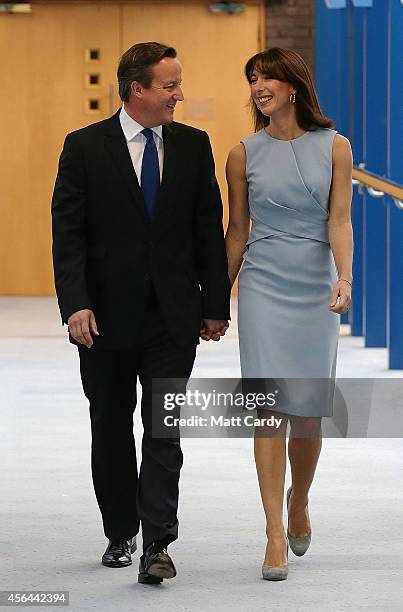Prime Minister David Cameron arrives with wife Samantha to deliver his keynote speech at the Conservative Party Conference in the main hall of the...