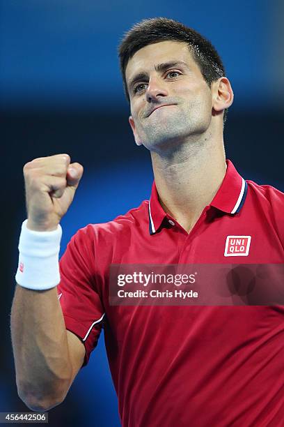 Novak Djokovic of Serbia celebrates winning his match against Vasek Pospisil of Canada during day five of of the China Open at the National Tennis...