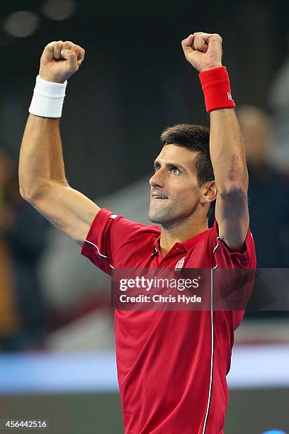Novak Djokovic of Serbia celebrates winning his match against Vasek Pospisil of Canada during day five of of the China Open at the National Tennis...