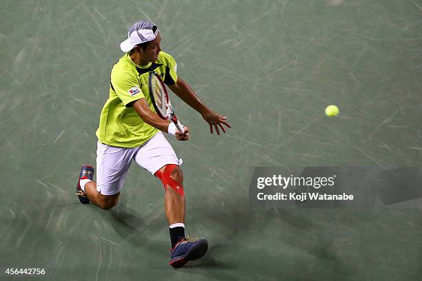 Tatsuma Ito of Japan in action during the men's singles second round match against Benjamin Becker of Germany on day three of Rakuten Open 2014 at...