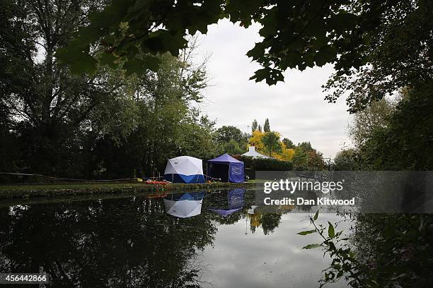 Forensic tents stand beside the Grand Union Canal on October 1, 2014 in London, England. The disappearance of teenager Alice Gross is now being...