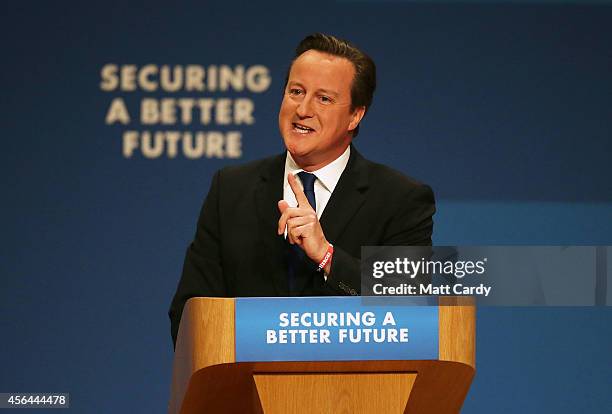 Prime Minister David Cameron delivers his keynote speech at the Conservative Party Conference in the main hall of the ICC Birmingham on October 1,...