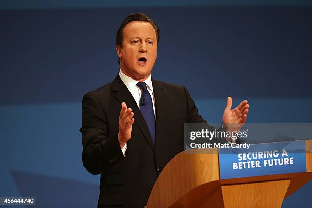 Prime Minister David Cameron delivers his keynote speech at the Conservative Party Conference in the main hall of the ICC Birmingham on October 1,...