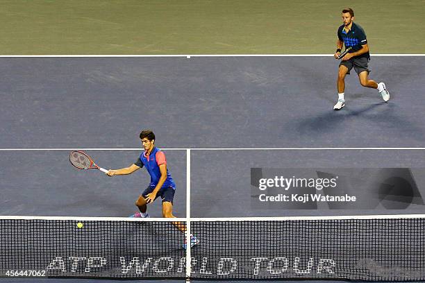 Pierre-Hugues Herbert of France and Michal Przysiezny of Poland in action during the men's doubles first round match against Bob Bryan and Mike Bryan...