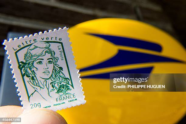 An envelop stamped with the effigy of Marianne, the official stamp of the French Republic is pictured on October 1, 2014 in Nieppe, northern France....