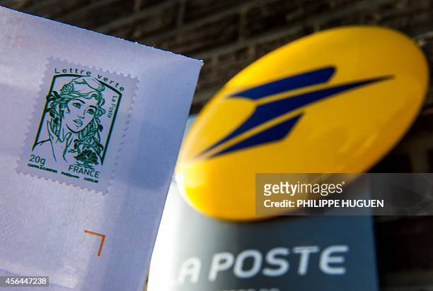 An envelop stamped with the effigy of Marianne, the official stamp of the French Republic is pictured on October 1,2014 in Nieppe, northern France....