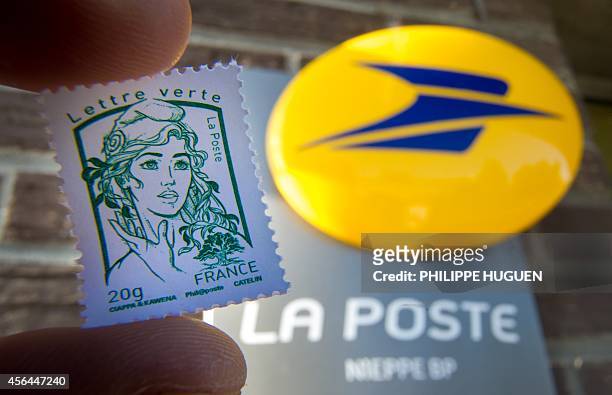 An envelop stamped with the effigy of Marianne, the official stamp of the French Republic is pictured on October 1, 2014 in Nieppe, northern France....